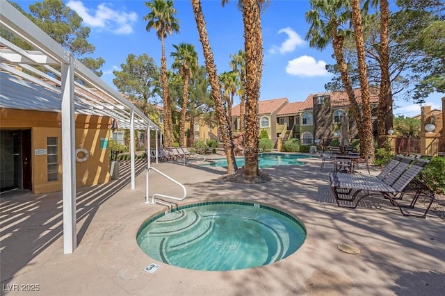 7950 W Flamingo Rd Unit 1003, Las Vegas, NV 89147 - community pool with a hot tub, a patio, and a residential view