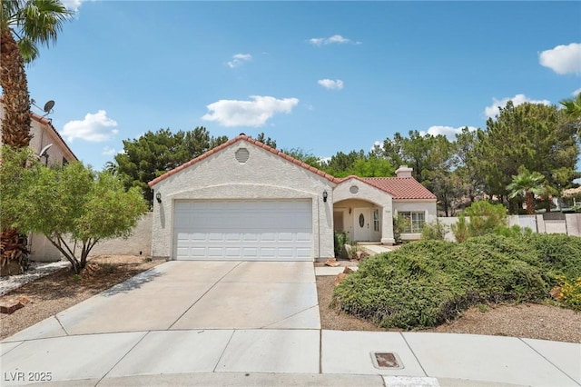 3201 Beacon Shores Cir, Las Vegas, NV 89117 - mediterranean / spanish house with a tiled roof, a garage, driveway, and stucco siding