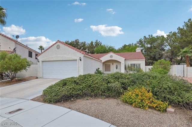 3201 Beacon Shores Cir, Las Vegas, NV 89117 - mediterranean / spanish-style house featuring a tiled roof, a garage, stucco siding, and concrete driveway
