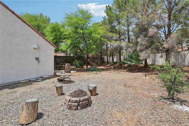 3201 Beacon Shores Cir, Las Vegas, NV 89117 - fenced backyard with a fire pit