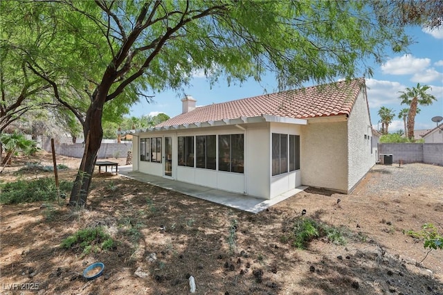 3201 Beacon Shores Cir, Las Vegas, NV 89117 - rear view of property with a tile roof, a chimney, stucco siding, a fenced backyard, and central air condition unit