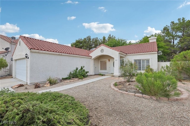 3201 Beacon Shores Cir, Las Vegas, NV 89117 - mediterranean / spanish home with a tiled roof, a chimney, an attached garage, and stucco siding