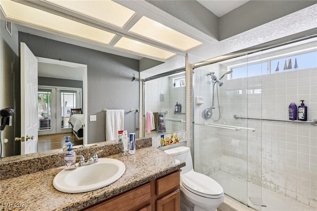 3201 Beacon Shores Cir, Las Vegas, NV 89117 - bathroom with toilet, a stall shower, vanity, and ensuite bathroom