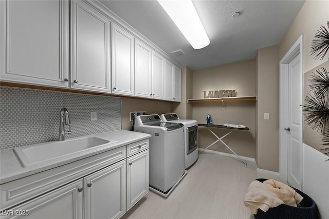 4702 Amazing View St, Las Vegas, NV 89129 - laundry area with washing machine and dryer, cabinet space, and baseboards