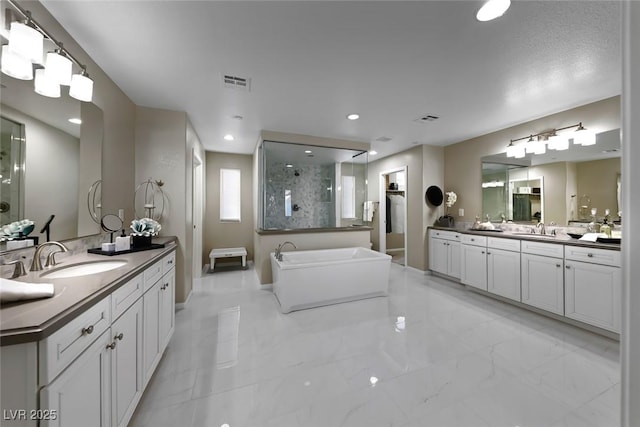 4702 Amazing View St, Las Vegas, NV 89129 - bathroom with a shower stall, two vanities, marble finish floors, a freestanding tub, and baseboards