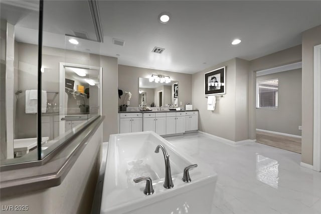4702 Amazing View St, Las Vegas, NV 89129 - full bathroom with a freestanding tub, vanity, recessed lighting, baseboards, and marble finish flooring