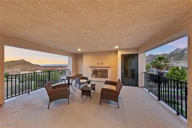 4702 Amazing View St, Las Vegas, NV 89129 - balcony with a mountain view and an outdoor living space with a fireplace