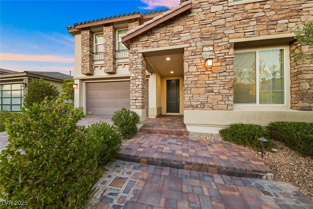 4702 Amazing View St, Las Vegas, NV 89129 - doorway to property with stone siding, stucco siding, and a balcony