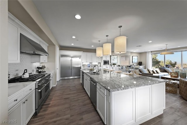 4702 Amazing View St, Las Vegas, NV 89129 - kitchen featuring high quality appliances, extractor fan, open floor plan, recessed lighting, and a sink