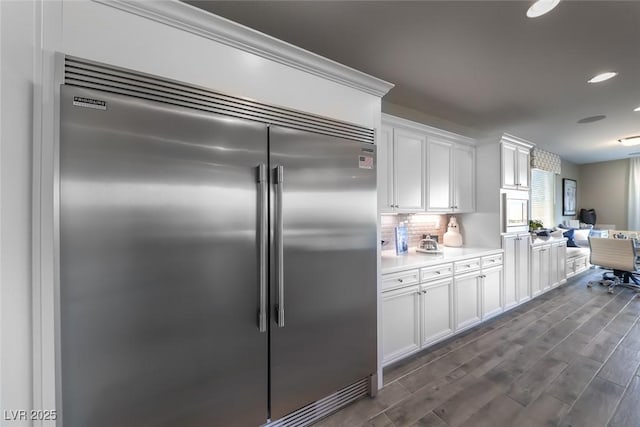 4702 Amazing View St, Las Vegas, NV 89129 - kitchen featuring stainless steel built in fridge, light countertops, white cabinets, decorative backsplash, and recessed lighting