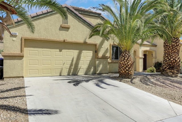 520 Blackbird Knoll Ct, North Las Vegas, NV 89084 - view of front of home with a garage, concrete driveway, and stucco siding