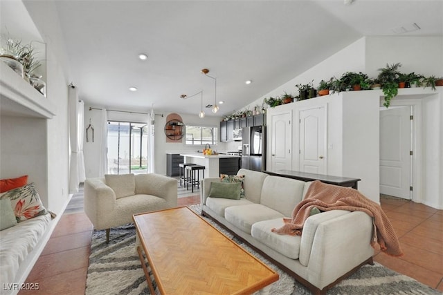 520 Blackbird Knoll Ct, North Las Vegas, NV 89084 - living area with lofted ceiling, recessed lighting, and light tile patterned floors