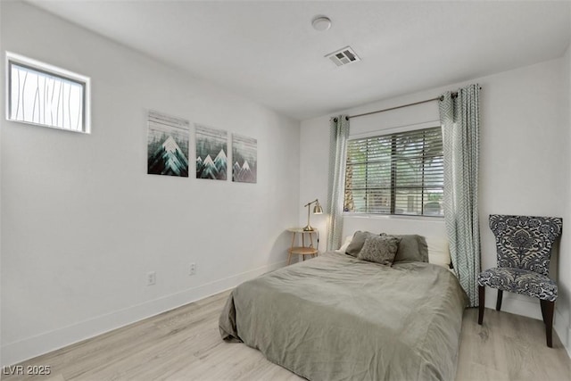 520 Blackbird Knoll Ct, North Las Vegas, NV 89084 - bedroom with light wood finished floors and baseboards