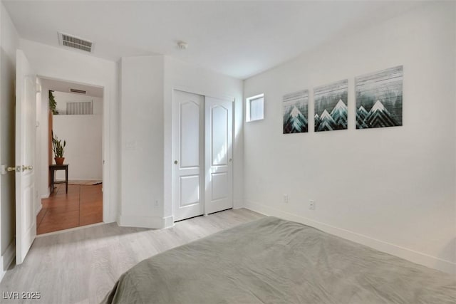 520 Blackbird Knoll Ct, North Las Vegas, NV 89084 - bedroom featuring light wood-style flooring, baseboards, and a closet