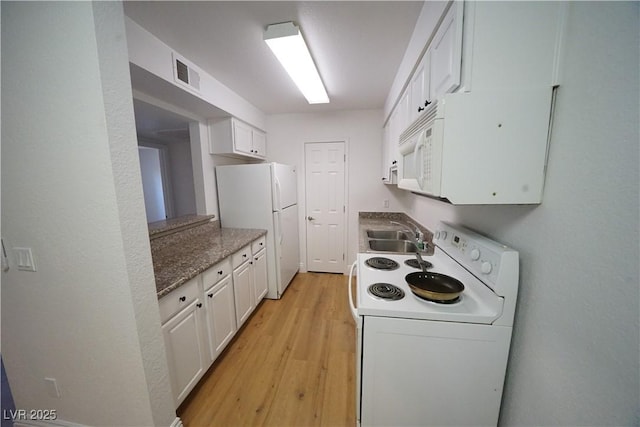 2606 S Durango Dr Unit 165, Las Vegas, NV 89117 - kitchen with white appliances, a sink, light wood-style floors, and white cabinets