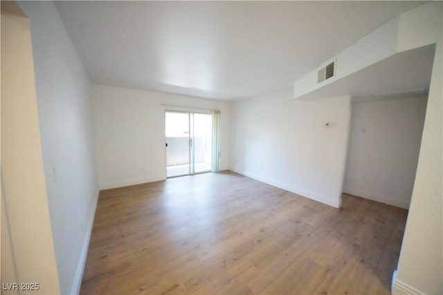 2606 S Durango Dr Unit 165, Las Vegas, NV 89117 - unfurnished room with wood finished floors and baseboards