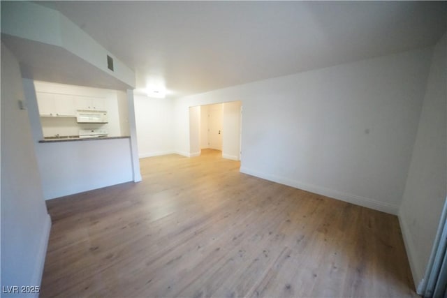 2606 S Durango Dr Unit 165, Las Vegas, NV 89117 - unfurnished living room with wood finished floors and baseboards