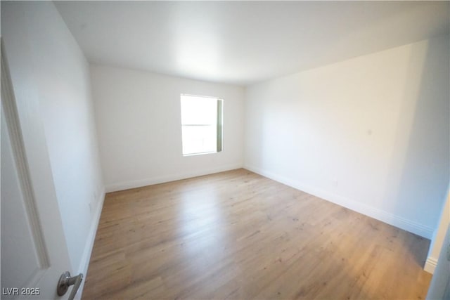 2606 S Durango Dr Unit 165, Las Vegas, NV 89117 - spare room featuring light wood finished floors and baseboards
