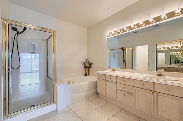 9622 Emeraude Ave, Las Vegas, NV 89147 - full bathroom with a stall shower, double vanity, a garden tub, and tile patterned floors