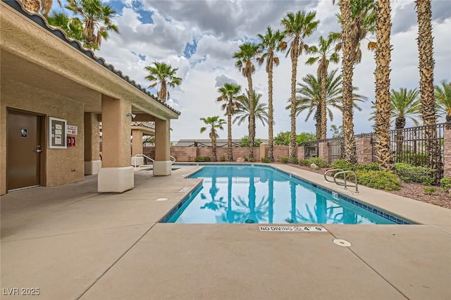 9622 Emeraude Ave, Las Vegas, NV 89147 - community pool with a patio area and a fenced backyard