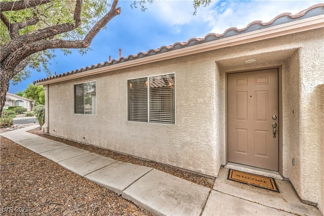 2177 Hidden Ranch Ter, Henderson, NV 89052 - doorway to property with stucco siding and a tiled roof