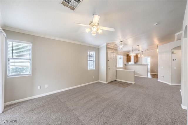 2177 Hidden Ranch Ter, Henderson, NV 89052 - unfurnished living room featuring ornamental molding, a ceiling fan, baseboards, and light carpet