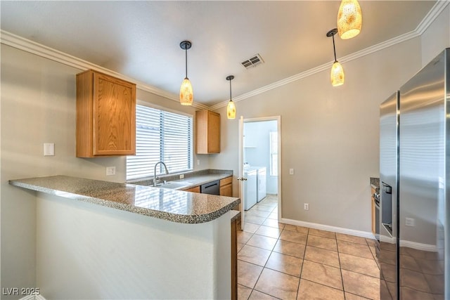 2177 Hidden Ranch Ter, Henderson, NV 89052 - kitchen featuring stainless steel appliances, washing machine and dryer, crown molding, a sink, and pendant lighting
