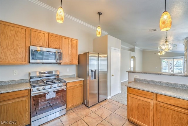 2177 Hidden Ranch Ter, Henderson, NV 89052 - kitchen featuring stainless steel appliances, arched walkways, ornamental molding, decorative light fixtures, and light countertops