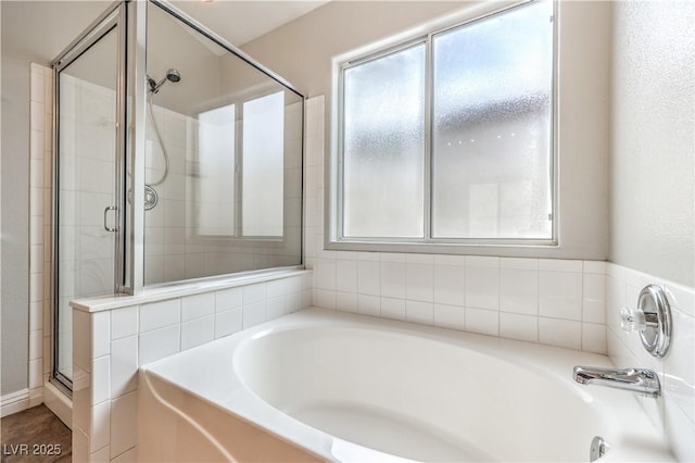 2177 Hidden Ranch Ter, Henderson, NV 89052 - bathroom with healthy amount of natural light, a garden tub, and a shower stall
