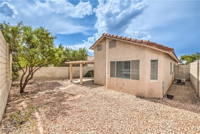 2177 Hidden Ranch Ter, Henderson, NV 89052 - view of property exterior featuring central air condition unit, stucco siding, a patio, and a fenced backyard