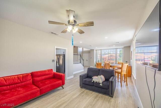 747 Canyon Crest Dr, Las Vegas, NV 89123 - living area with baseboards, light wood-style flooring, stairway, recessed lighting, and a ceiling fan
