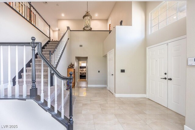 747 Canyon Crest Dr, Las Vegas, NV 89123 - entryway with a high ceiling, baseboards, stairs, light marble finish flooring, and recessed lighting