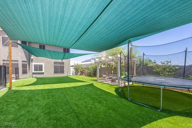 747 Canyon Crest Dr, Las Vegas, NV 89123 - view of yard with a trampoline and a pergola