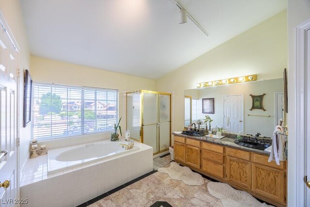 747 Canyon Crest Dr, Las Vegas, NV 89123 - full bath with lofted ceiling, a shower stall, a garden tub, double vanity, and tile patterned floors