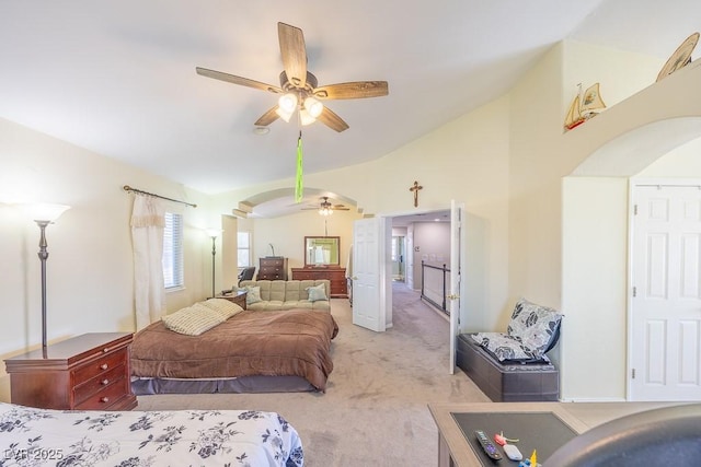 747 Canyon Crest Dr, Las Vegas, NV 89123 - bedroom featuring light colored carpet, arched walkways, and lofted ceiling