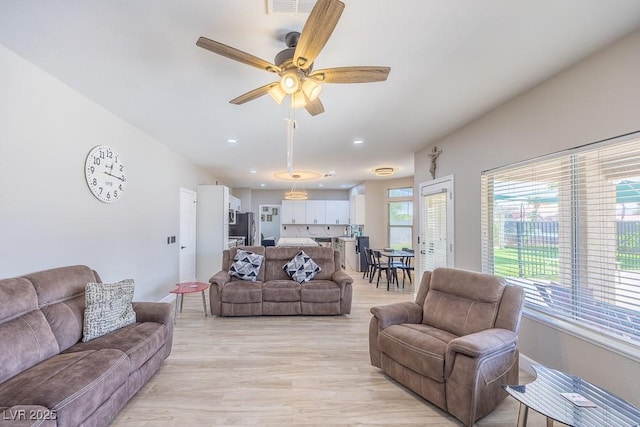 747 Canyon Crest Dr, Las Vegas, NV 89123 - living area with light wood finished floors, a ceiling fan, and recessed lighting