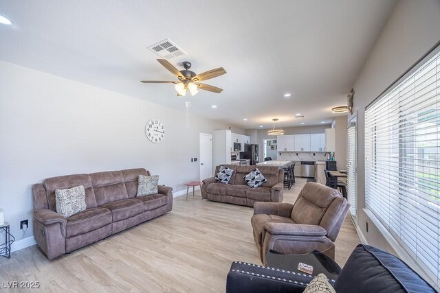 747 Canyon Crest Dr, Las Vegas, NV 89123 - living room with light wood-type flooring, baseboards, ceiling fan, and recessed lighting