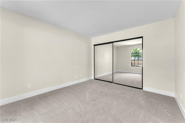 2964 Juniper Hills Blvd Unit 104, Las Vegas, NV 89142 - unfurnished bedroom with carpet flooring, baseboards, and a closet