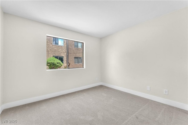 2964 Juniper Hills Blvd Unit 104, Las Vegas, NV 89142 - unfurnished room featuring carpet floors and baseboards