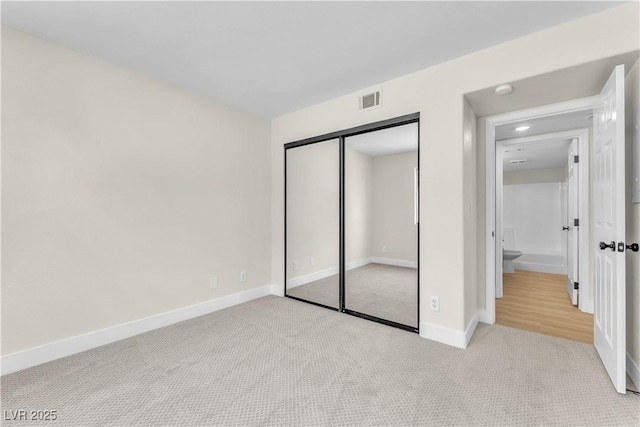 2964 Juniper Hills Blvd Unit 104, Las Vegas, NV 89142 - unfurnished bedroom with carpet flooring, baseboards, and a closet