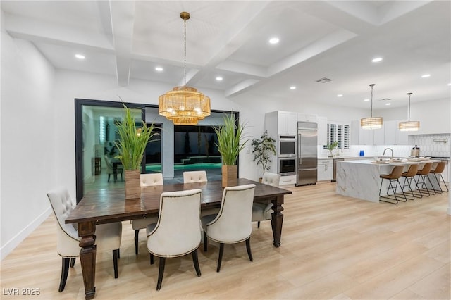 5225 Villa Dante Ave, Las Vegas, NV 89141 - dining room featuring light wood-style flooring, recessed lighting, beam ceiling, and a chandelier