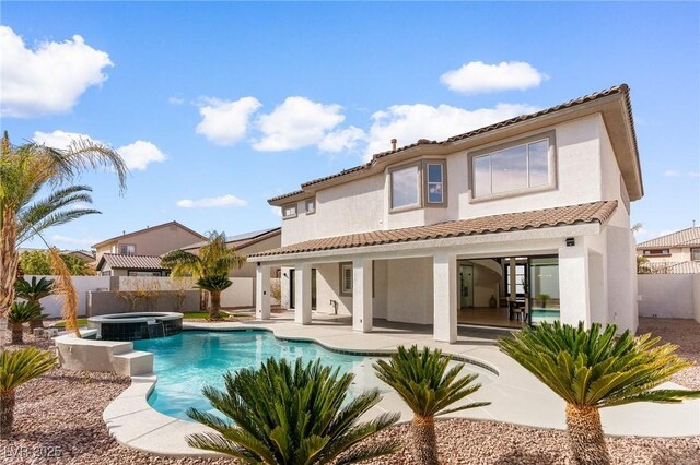 5225 Villa Dante Ave, Las Vegas, NV 89141 - rear view of property featuring a patio area, stucco siding, and a fenced backyard