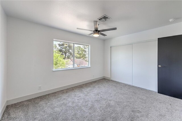 1805 Amboy Dr, Las Vegas, NV 89108 - unfurnished bedroom with carpet flooring, a closet, and ceiling fan