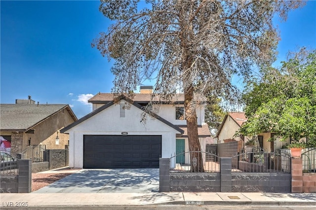 1805 Amboy Dr, Las Vegas, NV 89108 - view of front of house with an attached garage, a gate, stucco siding, concrete driveway, and a fenced front yard