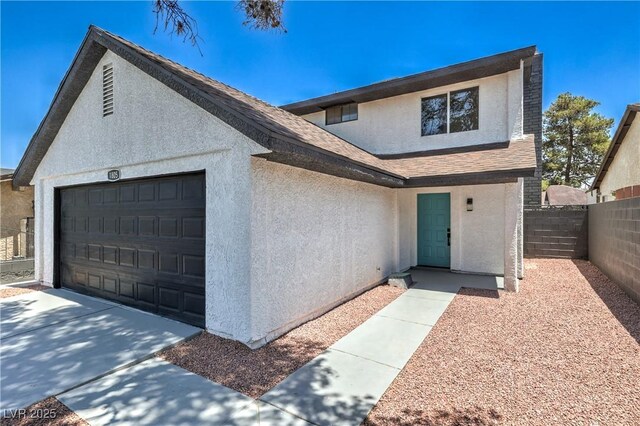1805 Amboy Dr, Las Vegas, NV 89108 - view of front facade featuring stucco siding, a garage, and roof with shingles