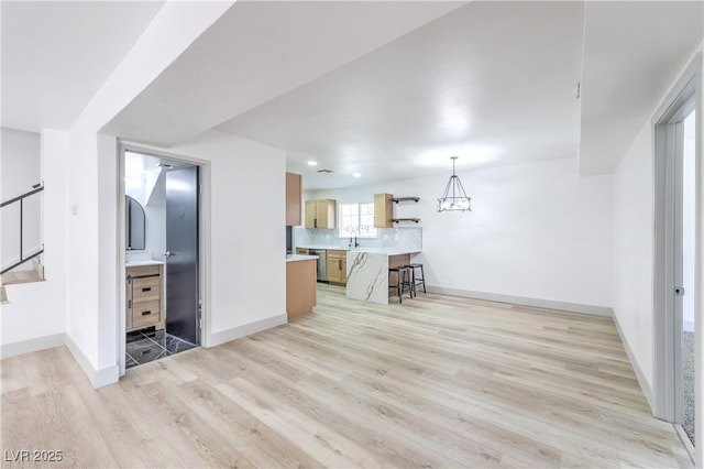 1805 Amboy Dr, Las Vegas, NV 89108 - living area with light wood-style flooring and stairs