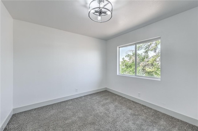1805 Amboy Dr, Las Vegas, NV 89108 - carpeted empty room featuring a chandelier and baseboards