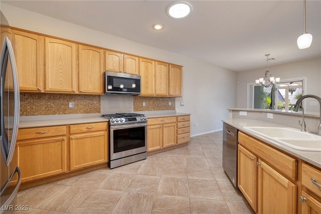 2221 River Grove Dr, Henderson, NV 89044 - kitchen with appliances with stainless steel finishes, backsplash, light countertops, decorative light fixtures, and recessed lighting