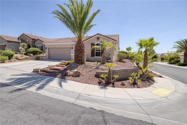 2221 River Grove Dr, Henderson, NV 89044 - mediterranean / spanish-style home with stucco siding, an attached garage, and driveway