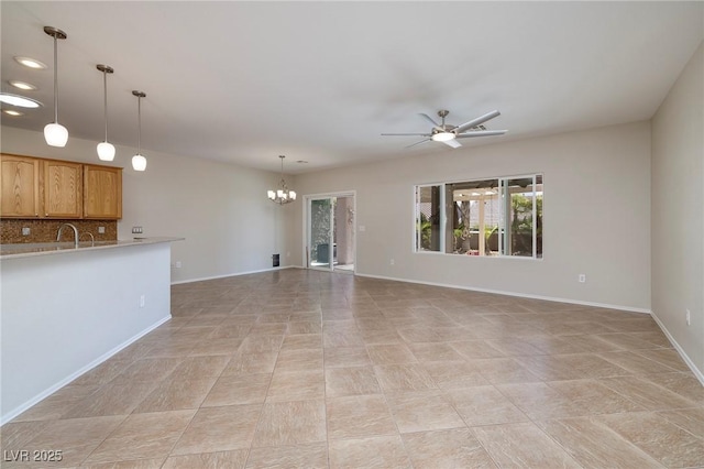 2221 River Grove Dr, Henderson, NV 89044 - unfurnished living room with a chandelier, plenty of natural light, ceiling fan, and recessed lighting